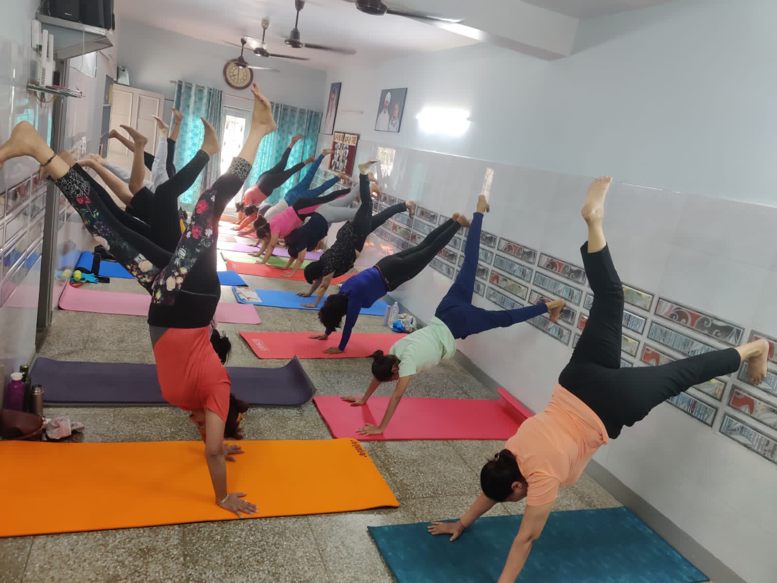 Traditional Hatha yoga tree pose class demonstrating balanced alignment at Nirankari Yoga Centre, Gurugram
